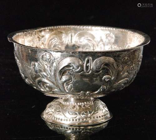 A 19th Century Dutch silver small pedestal bowl decorated with rural scenes below beaded borders