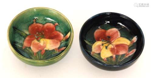 Two small Moorcroft footed bowls decorated in the African Lily pattern