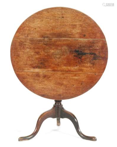 A George III oak tripod occasional table on slender splayed legs