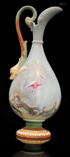 An early 20th Century Royal Worcester shape 2441 pedestal ewer decorated in the manner of George Johnson with a hand painted flamingo wading through grass