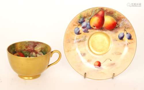 A matched Royal Worcester Fallen Fruits cabinet teacup and saucer