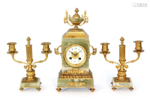 An early 20th Century French gilt green onyx clock garniture set with eight day striking movement