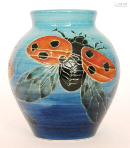 A Dennis China Works vase decorated to a design by Sally Tuffin with ladybirds against a blue wash ground