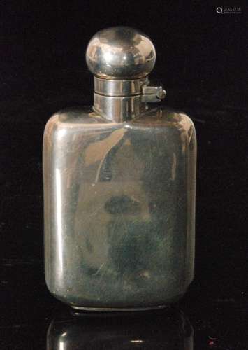 A Victorian hallmarked silver small hip flask of plain form terminating in bayonet cap