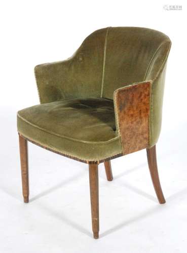 A second quarter 20th Century tub shaped armchair in the manner of Gordon Russell