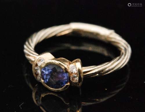 A contemporary 14ct tanzanite and diamond ring