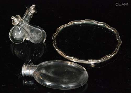 A hallmarked silver and clear glass hip flask