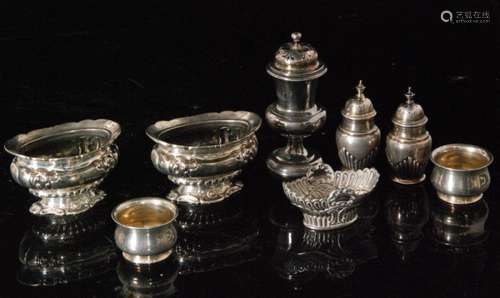 Eight hallmarked Victorian and later condiments to included a pair of peppers