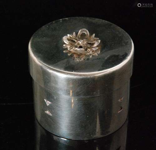 A modern hallmarked silver cylindrical ring box of plain form with a small bow to cover