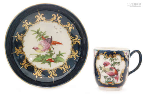 A late 18th Century Worcester coffee cup and saucer decorated with cartouche panels of 'Fancy Birds' and insects against a faint blue scale ground