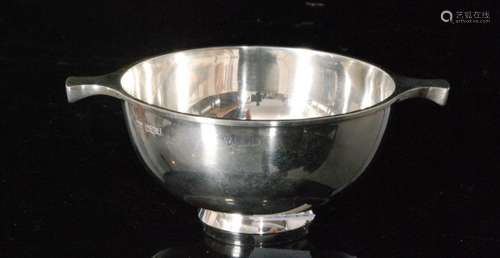 A hallmarked silver quaich of plain from terminating in strut side handles