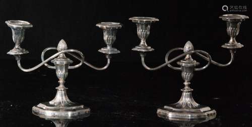 A pair of hallmarked silver two light squat candelabra