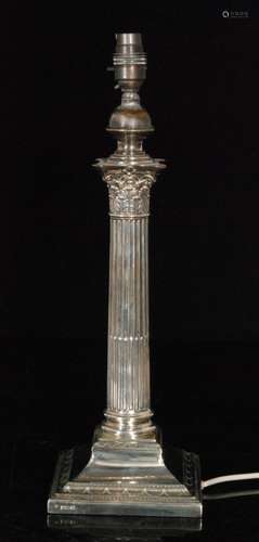 An early 20th Century hallmarked silver Corinthian column table lamp terminating in acanthus leaf capital