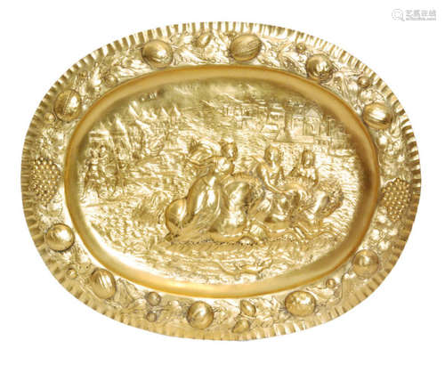 A 19th Century Dutch silver oval silver gilt tray with embossed scene of three women on horseback fording a river with soldiers and tents to one side and a town buildings to the other