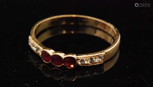 An 18ct ruby and diamond nine stone ring