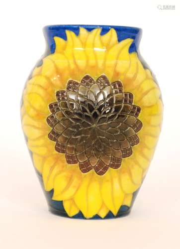 A Dennis China Works vase decorated to a design by Sally Tuffin with two sunflowers against a blue wash ground