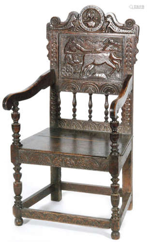 A 19th century carved oak Wainscot style elbow chair