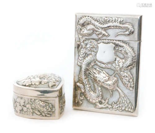 A Chinese silver rectangular card case decorated with a scrolling dragon to one side and prunus flowers to the other