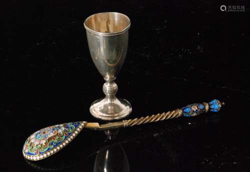 A Russian silver gilt spoon with multi coloured enamel decoration to reverse of bowl and further enamel detail to terminal