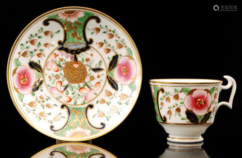 A 19th Century Swansea London shape coffee cup and saucer decorated in the Japan pattern with a central gilt chrysanthemum and foliage framed with pink and gilt flowers and foliage