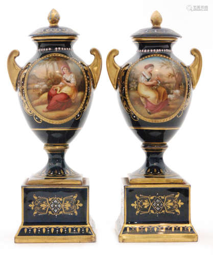 A pair of late 19th to early 20th Century continental pedestal vase and covers each decorated with a hand painted roundel depicting a young farm girl sat beside sheep