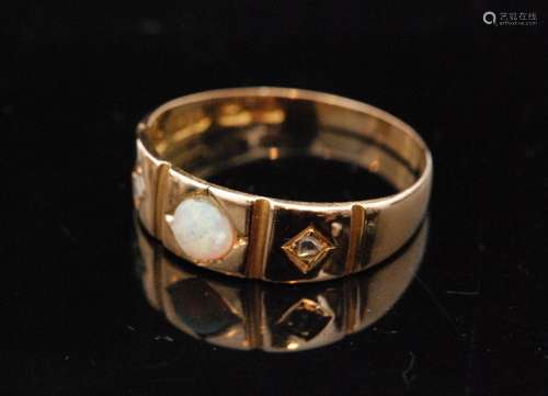 An early 20th Century 15ct hallmarked opal and diamond three stone ring