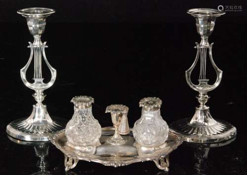 A pair of 19th Century silver plated lyre candlesticks with oval fluted bases and elliptical sconces