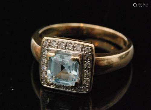 A 9ct hallmarked aquamarine and diamond cluster ring