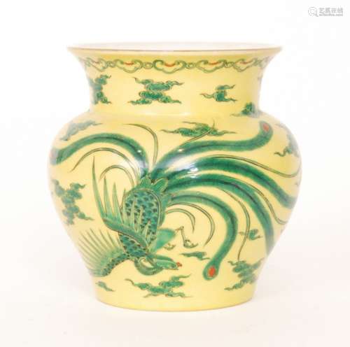 An early 20th Century Japanese vase decorated with a green dragon and a long tailed feathered bird  amidst stylised clouds with red detailing