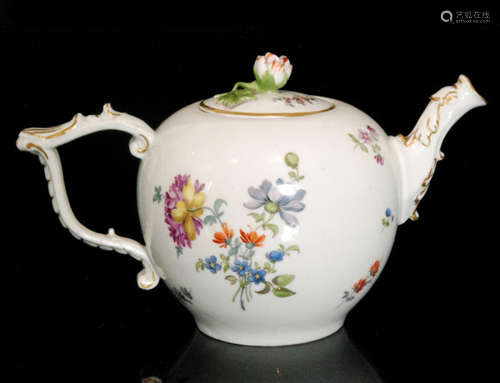 A late 18th Century Meissen porcelain teapot and cover of bullet form with tau handle and dragon spout decorated with hand painted Deutsche Blumen with gilt detailing to the handle and spout