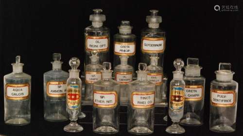 A pair of 19th Century pharmaceutical jars and pourer stoppers named 'Glycerinum' and 'Ol ricini Opt'