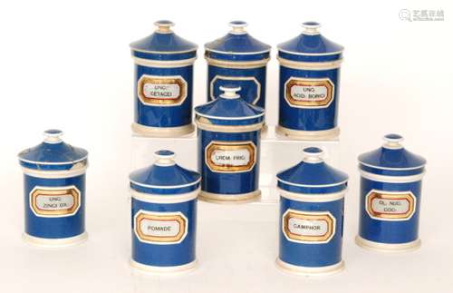 Eight 19th Century blue glazed named pharmaceutical pottery jars and covers named Pomade