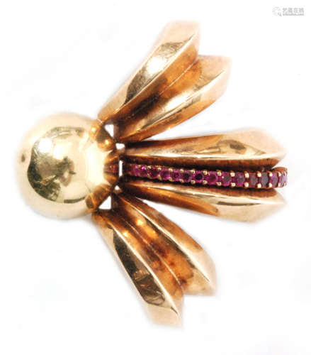 An American clip brooch designed as a circular button with a three crescent shaped scrolled surmount