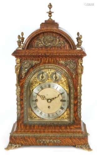 A late 19th Century musical bracket clock with pull cord striking on eight graduated bells with circular silvered chapter ring and matted centre incorporating two subsidiary dials Chime/Silent and Westminster eight bells