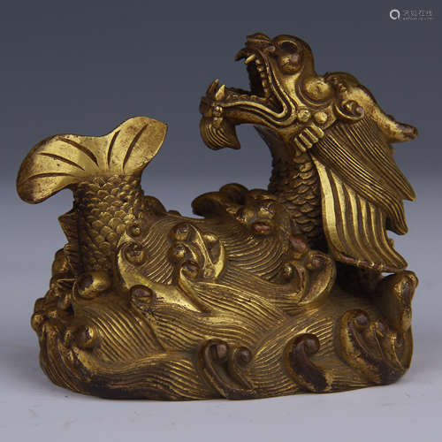 A GILT-BRONZE BEAST