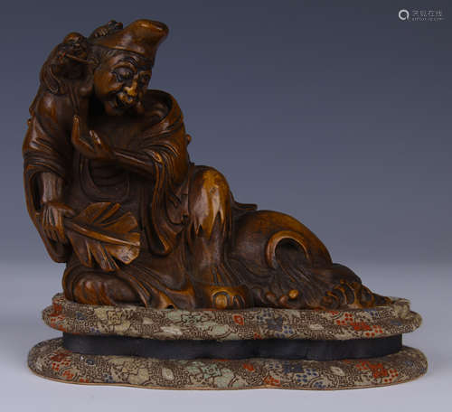 CHINESE CARVED BAMBOO RECUMBENT ARHAT ON STAND