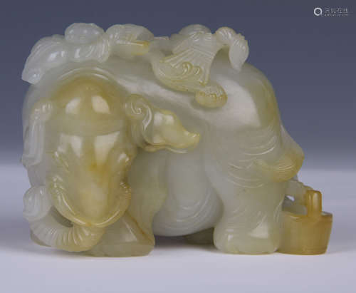 A FINE CARVED JADE OF COUCHING ELEPHANT