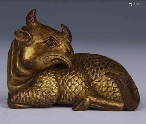 A GILT-BRONZE BEAST