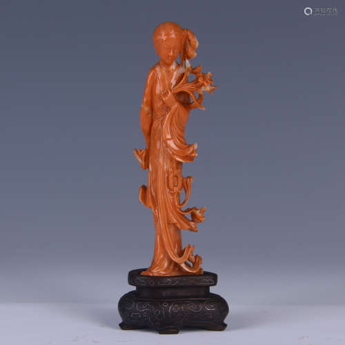 A RED CORAL CARVED BEAUTY STATUE/ WOODEN STAND