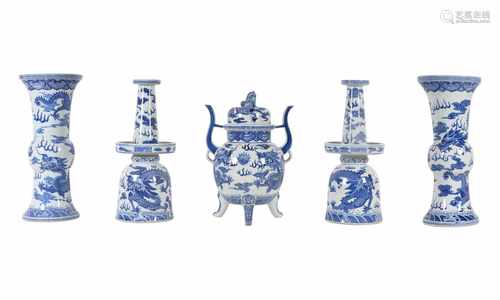 A lot of five blue and white porcelain objects, including two vases, two candle stick holders and an