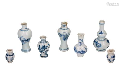 Lot of seven blue and white porcelain miniature vases with floral decor. Unmarked. China, Kangxi. H.