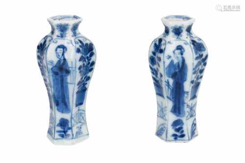 A pair of hexagonal blue and white porcelain miniature vases, decorated with long Elizas and