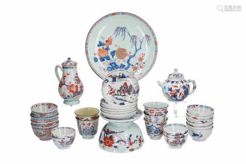 A lot of Imari porcelain items, including a teapot, milk jug, two bowls, a dish, 21 cups and 7