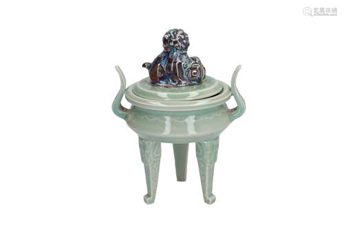 A tripod celadon and flambé glazed insence burner. The handle of the cover in the shape of a Fo-