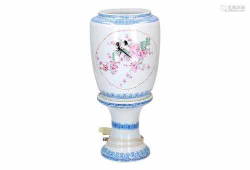 A two-piece polychrome porcelain lamp stand with eggshell porcelain top, decorated with birds and