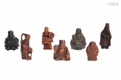 Lot of seven netsuke, 1) Wooden Jurojin. Signed Masayuki. H. 4 cm. 2) Wooden Jurojin with fan. H.