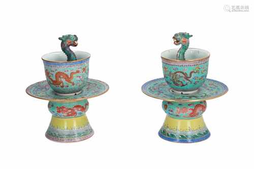 A lot of two polychrome porcelain dragon puzzle cups on stand, decorated with dragons and flowers.