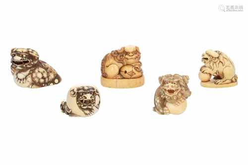 Lot of five netsuke, 1) Ivory Daikoku's rat on Hotei's bag. L. 5 cm. 2) Ivory temple bell with