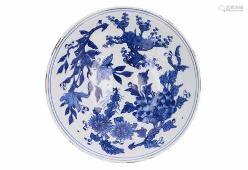 A blue and white porcelain deep dish with floral decor. Marked with 6-character mark Jiajing. China,