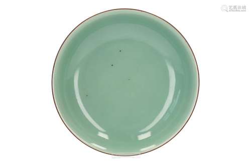 A celadon porcelain deep dish. Marked with seal mark Jiaqing. China, Jiaqing. Diam. 19,5 cm. H. 4